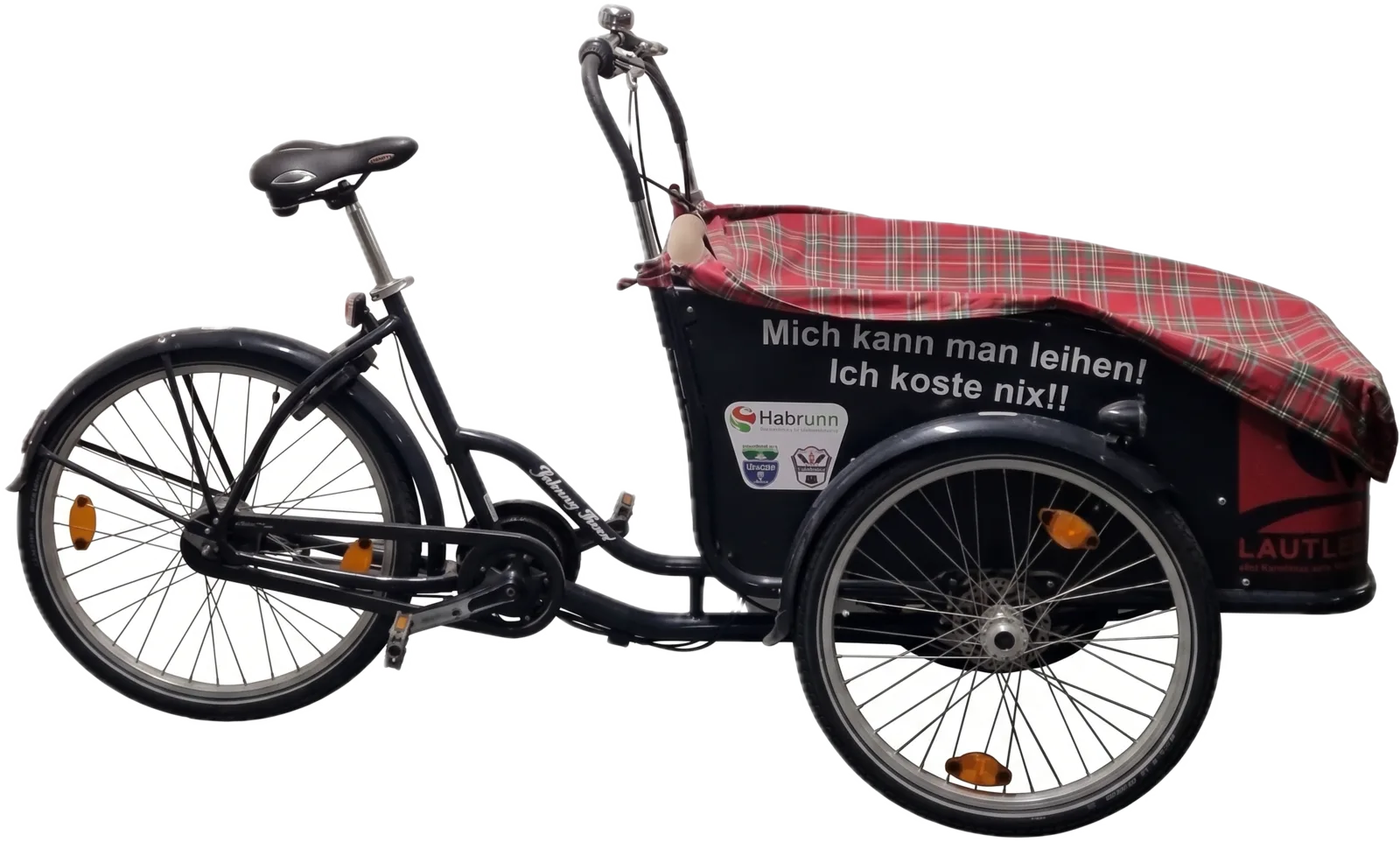 Das dreirädrige Lastenrad LAgenda mit Transportbox und Regenverdeck